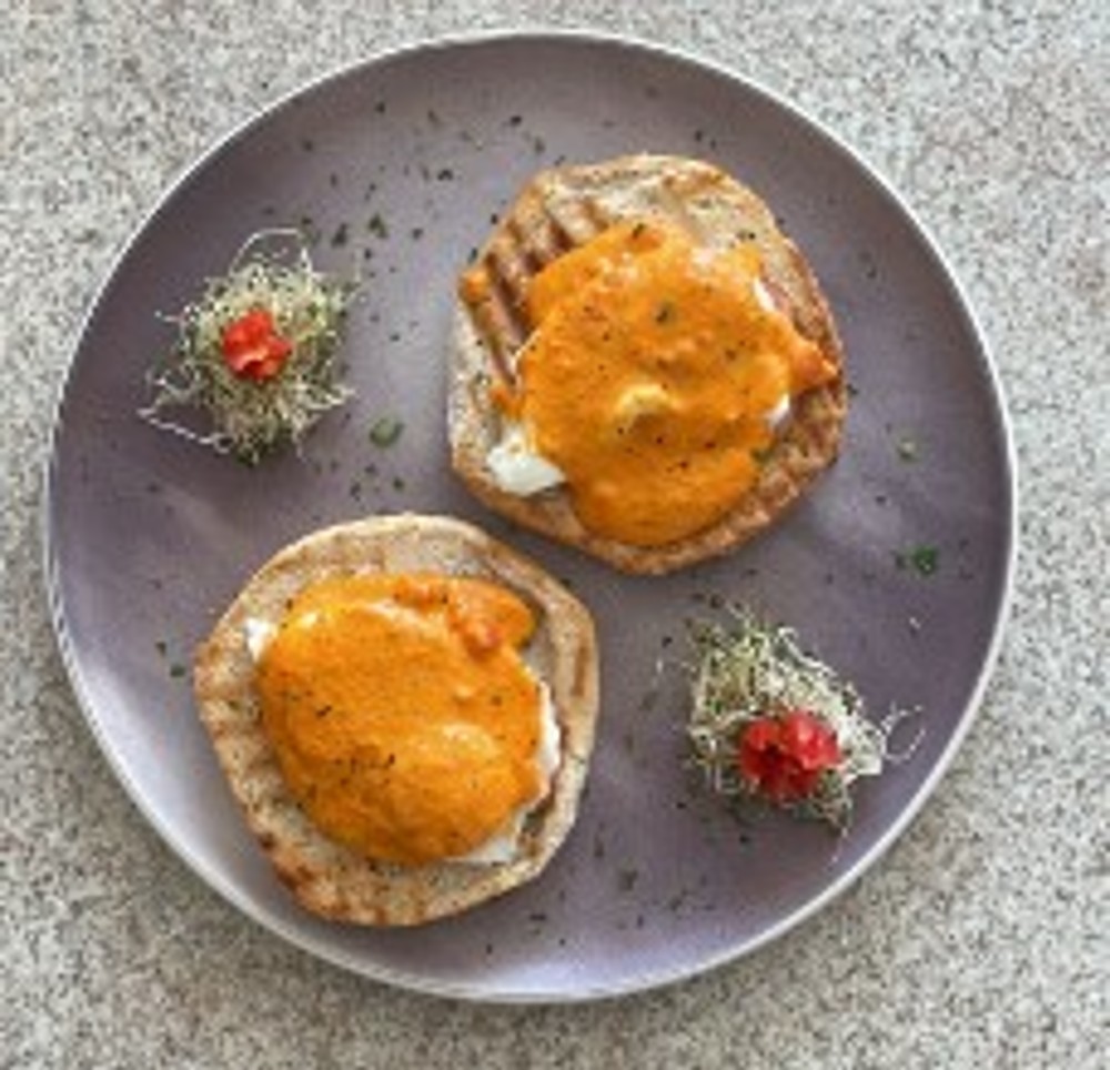 Huevos Poché en salsa de pimiento