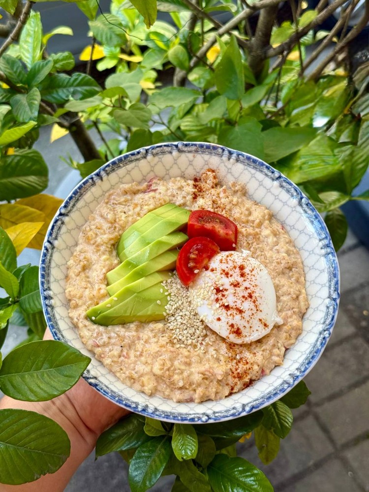 Salted oatmeal with cherry tomatoes and cheese