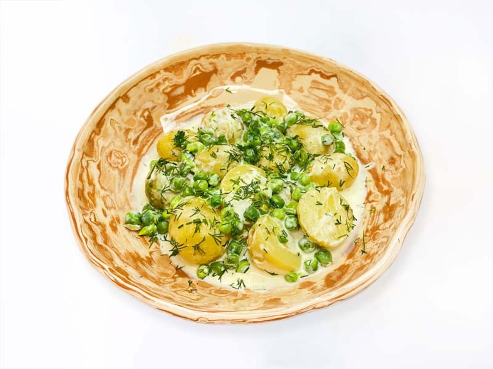 Молода картопля з вершками та кропом