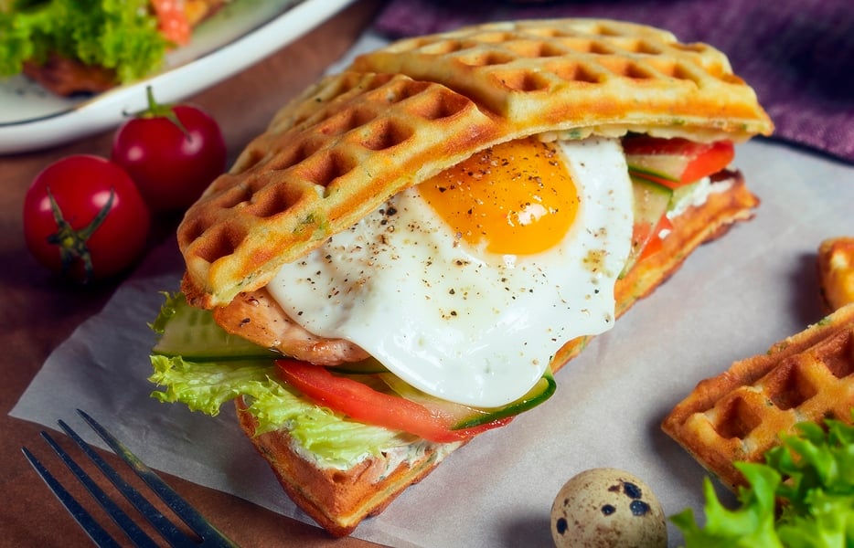 Waffle sandwich with chicken, egg and cheese