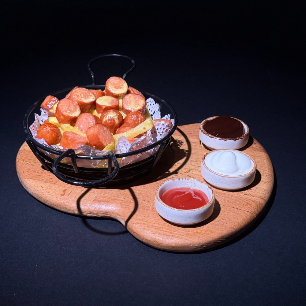 French fries with sausage and cheddar sauce