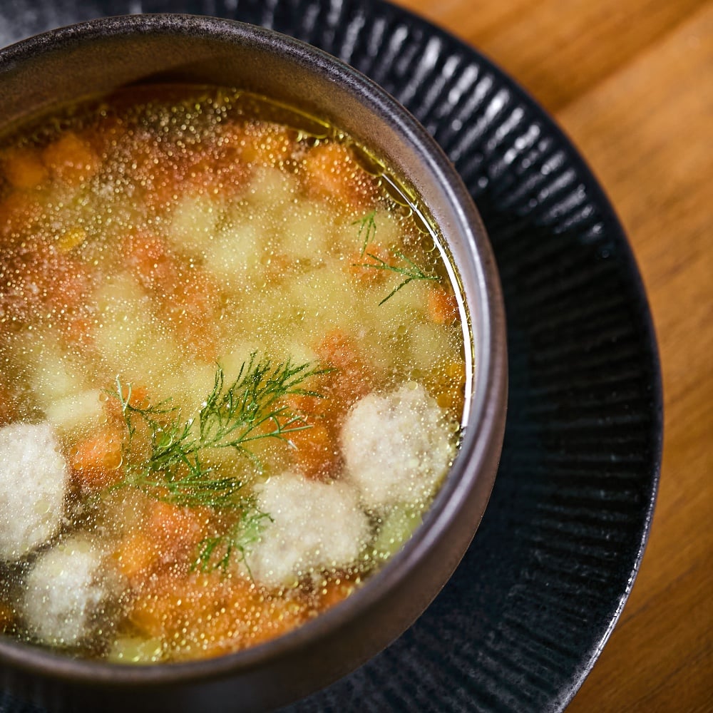 Chicken broth with meatballs