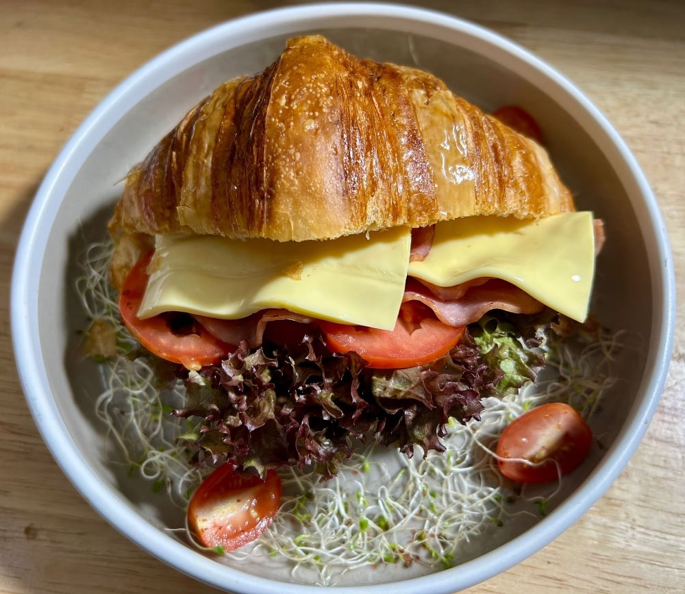 Ham and cheese croissant, tomato salad