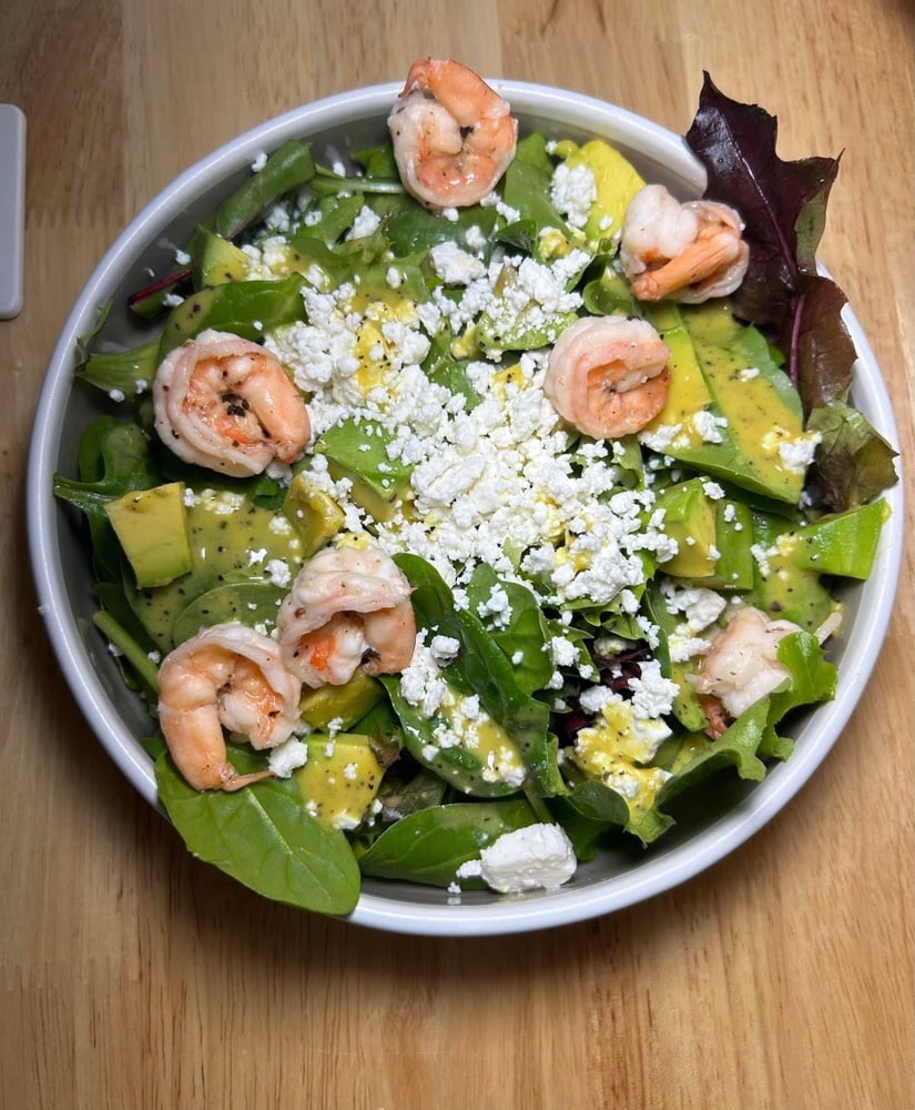 Salad with Shrimps, Avocado and Feta Cheese. In orange dressing 