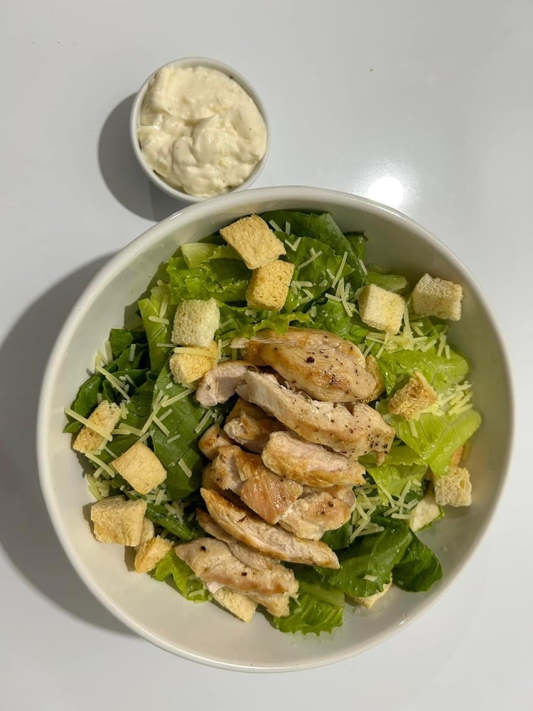 Caesar with chicken, homemade sauce and parmesan 