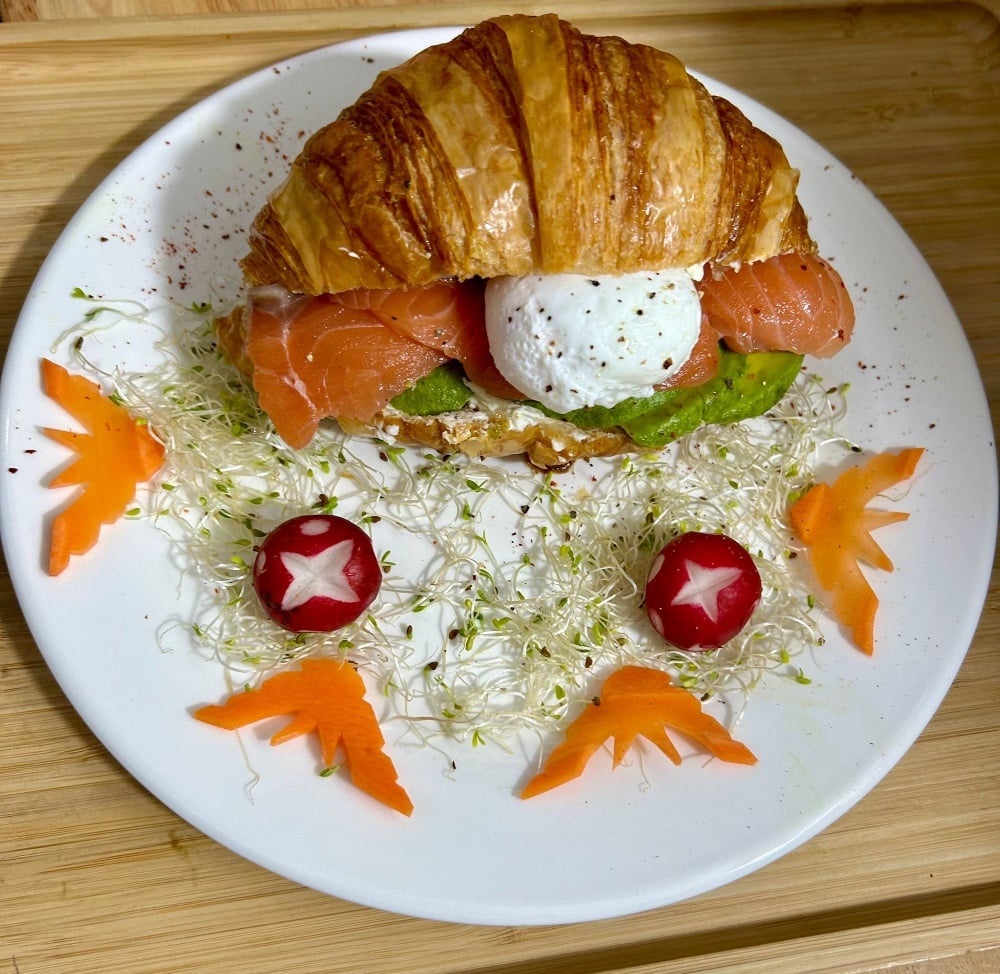 Croissant with Creme Cheese, avocado, salmon and poached egg 