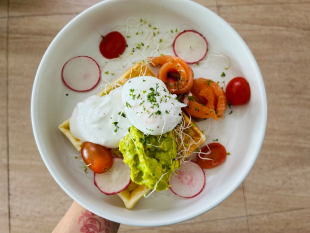 Waffle with poached egg and salmon ,Avocado and Smoked sour cream