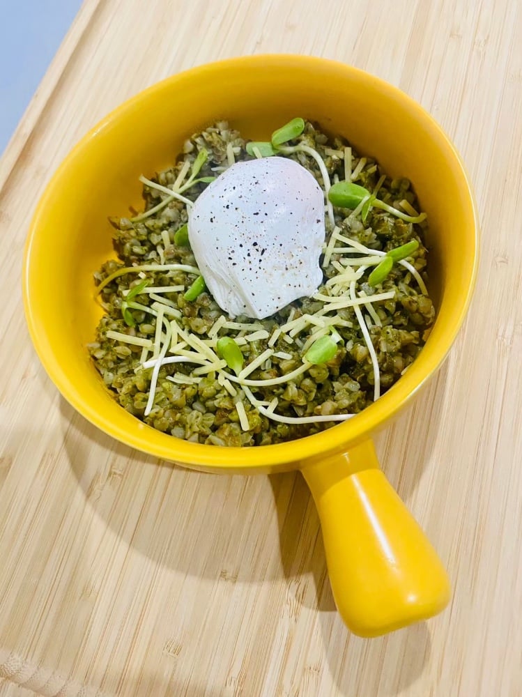 Buckwheat with pesto sauce, poached egg and parmesan
