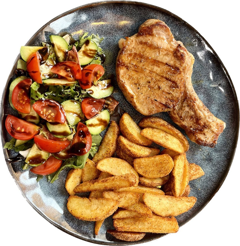 Свиний стейк з корейки на кості з картоплею по-селянськи і салатом/Pork chop steak with salad and potato