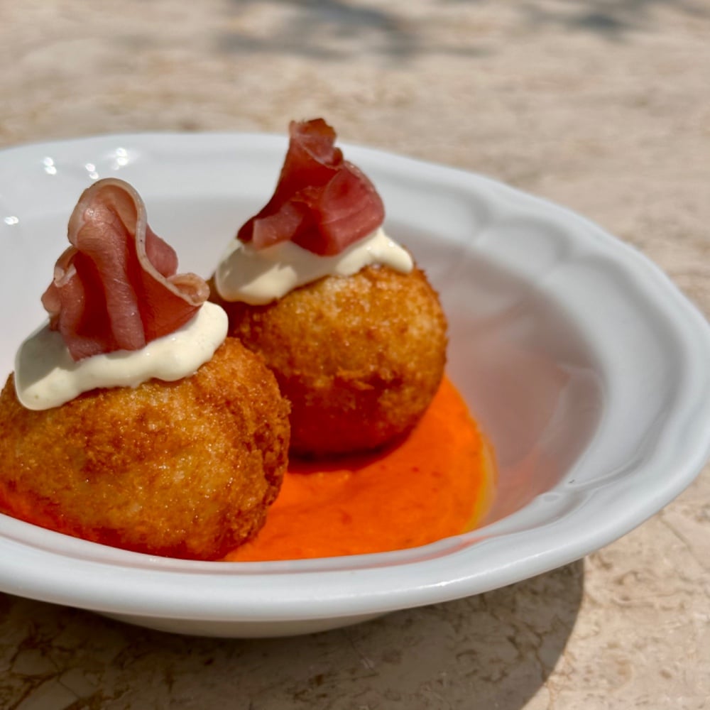 Croquettes with ham and romesco sauce d