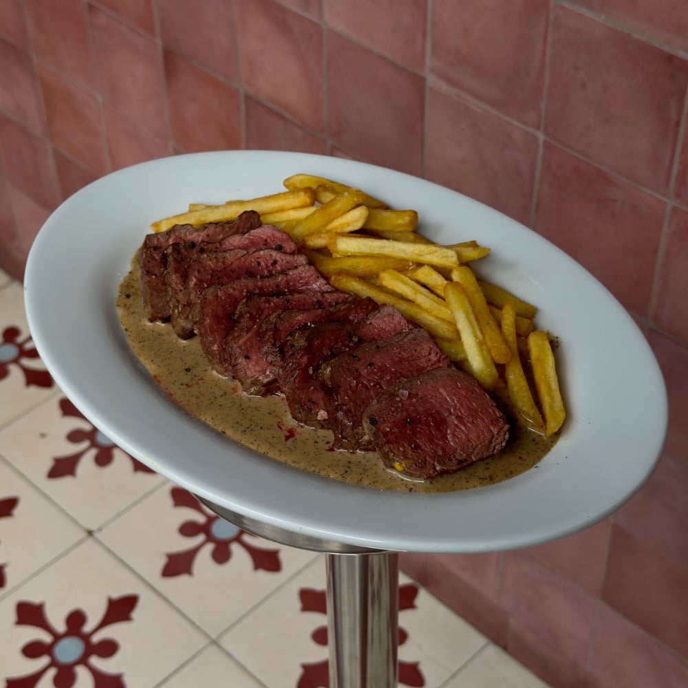 Steak Mignon with fries and pepper sauce