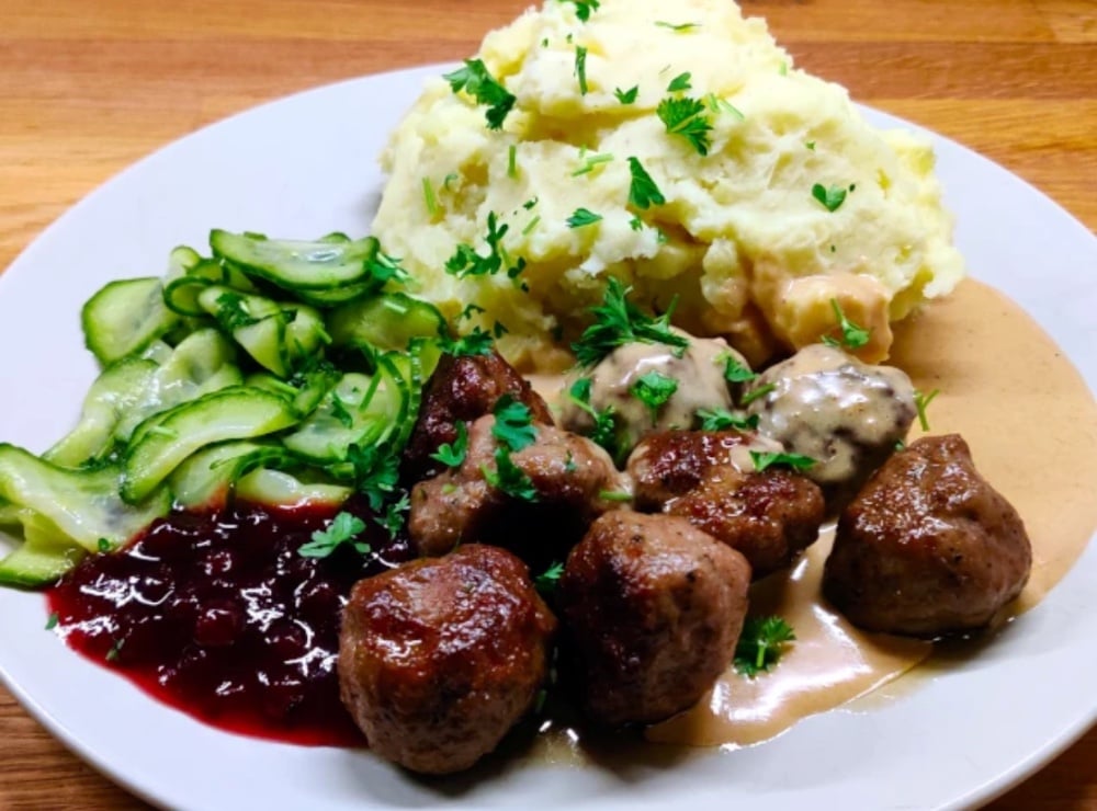 Swedish Meatballs with potatoes, cream sauce, pickled cucumbers and lingonberry sauce