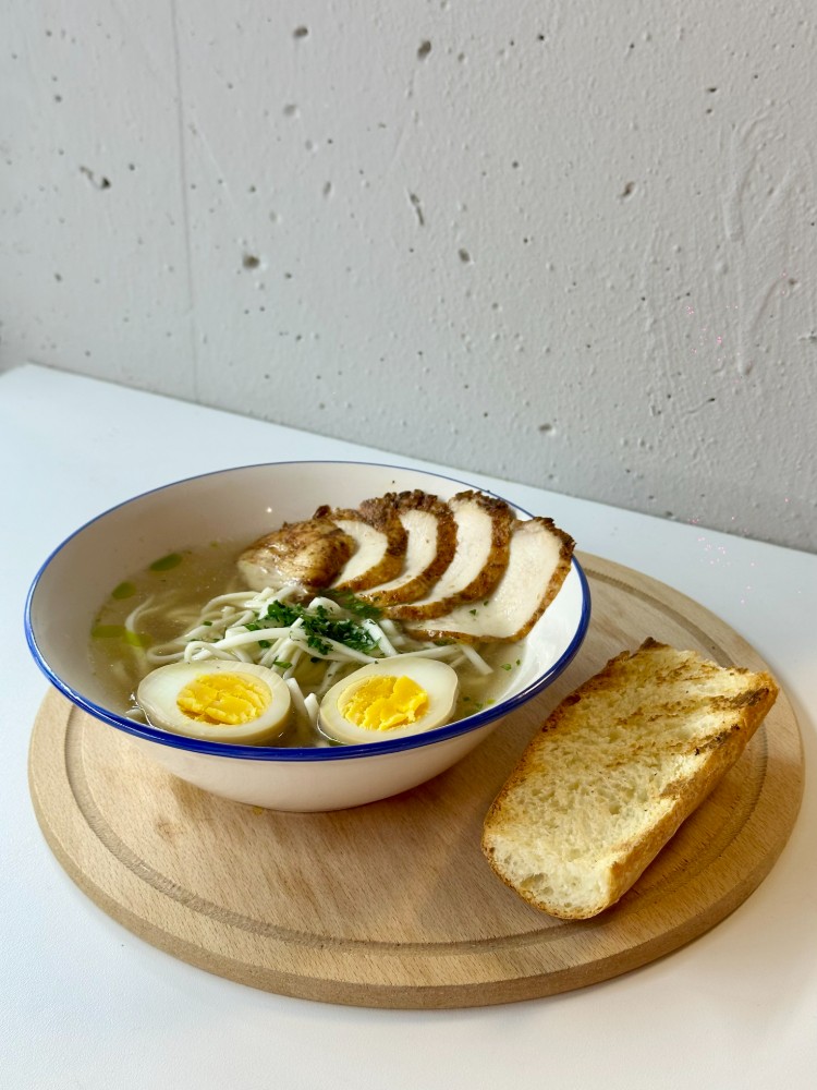 Chicken soup with noodles and egg