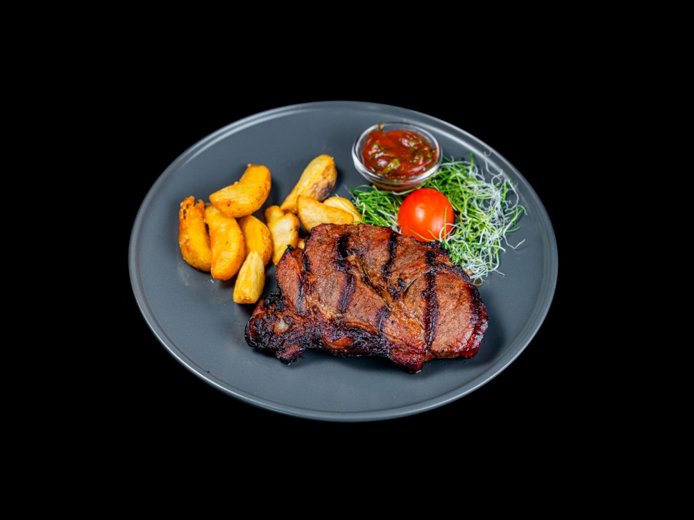 Стейк зі свинини.