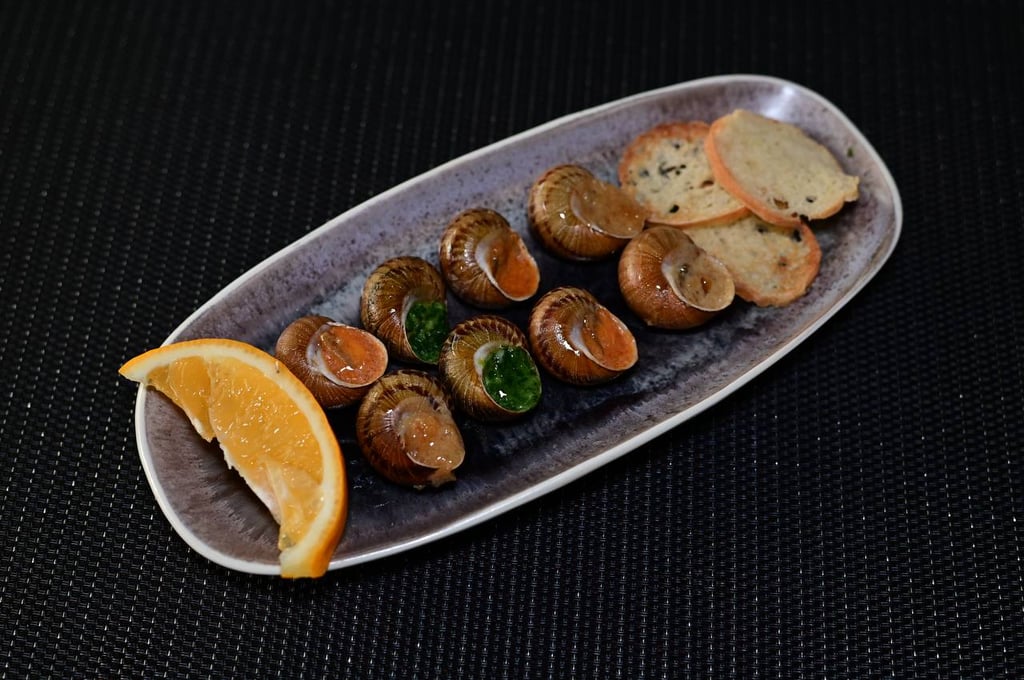 Равлики в соусі