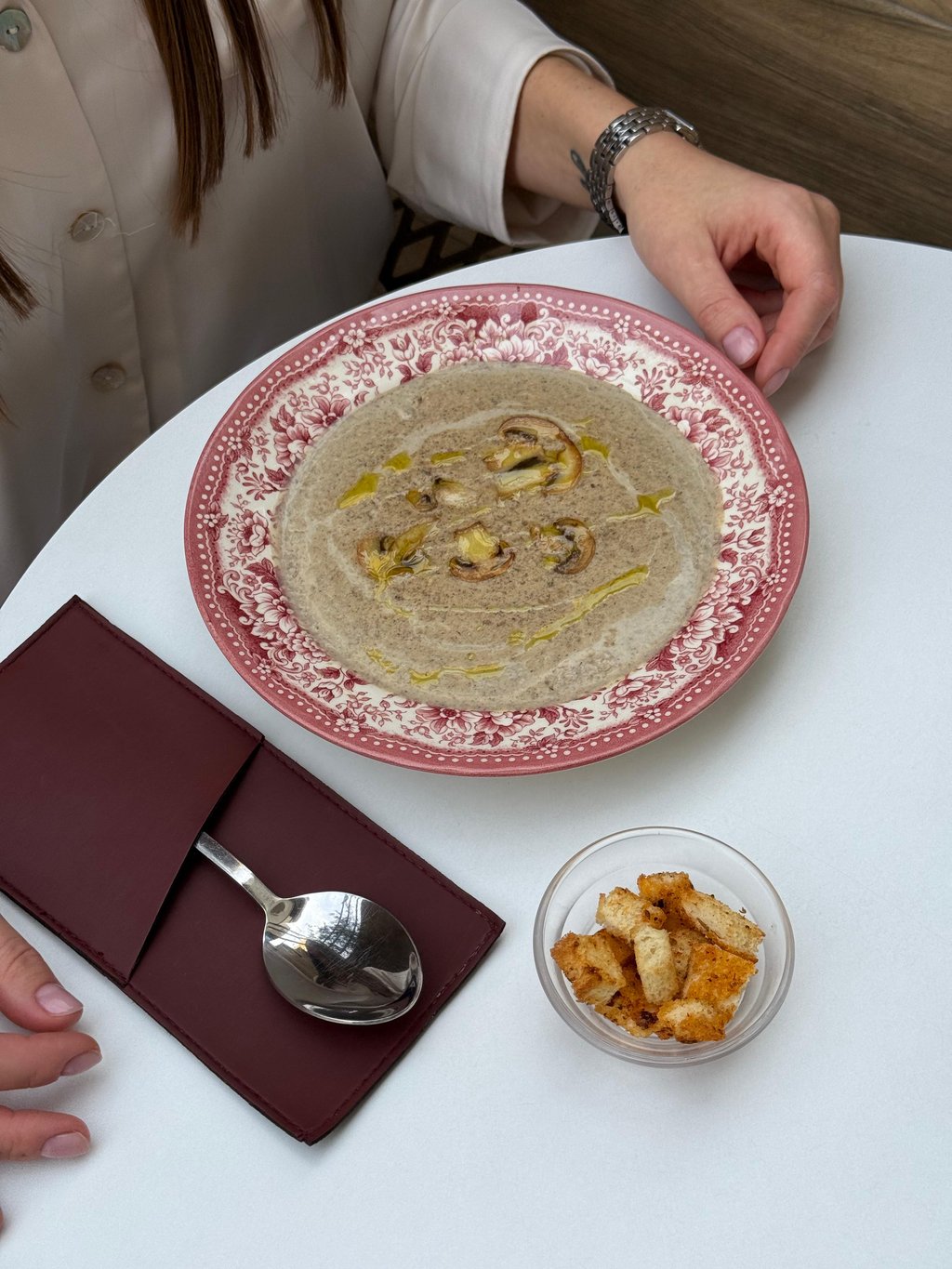 Creamy mushroom soup with green oil 