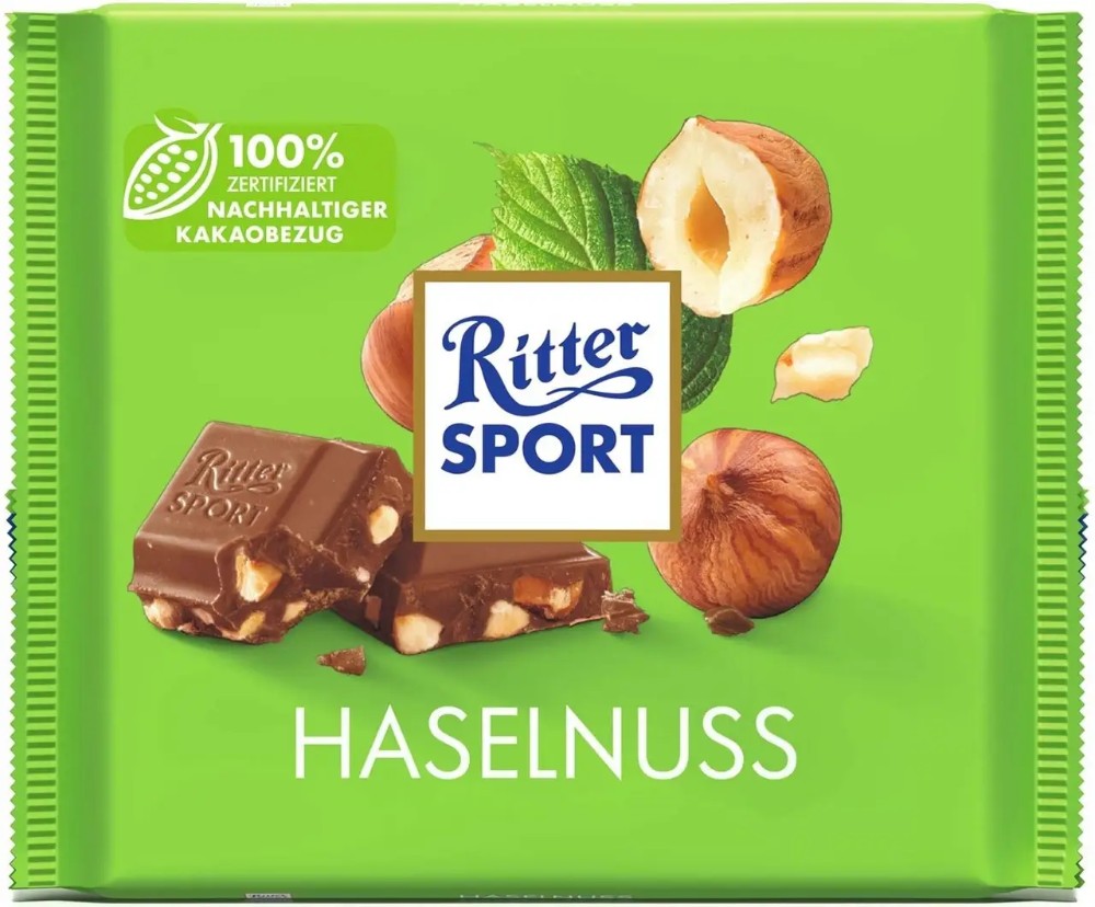 Молочний шоколад цільні лісові горіхи Ritter Sport 100г