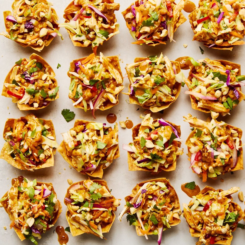 Shredded Rotisserie Chicken Gets Tossed in a Spicy-Sweet Peanut Sauce, Stuffed in a Taco Cups 