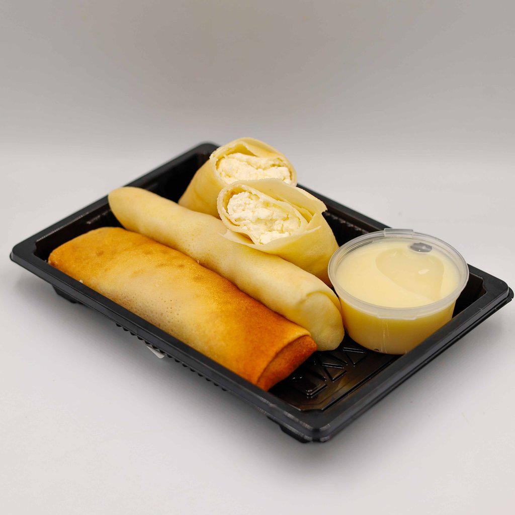 МЛИНЦІ З КИСЛОМОЛОЧНИМ СИРОМ ТА ВАНІЛЬНИМ СОУСОМ (ПОРЦІЯ)