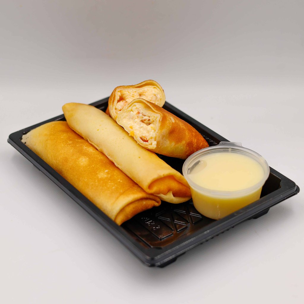 МЛИНЦІ З МАНГО, СИРОМ ТА ВАНІЛЬНИМ СОУСОМ (ПОРЦІЯ)