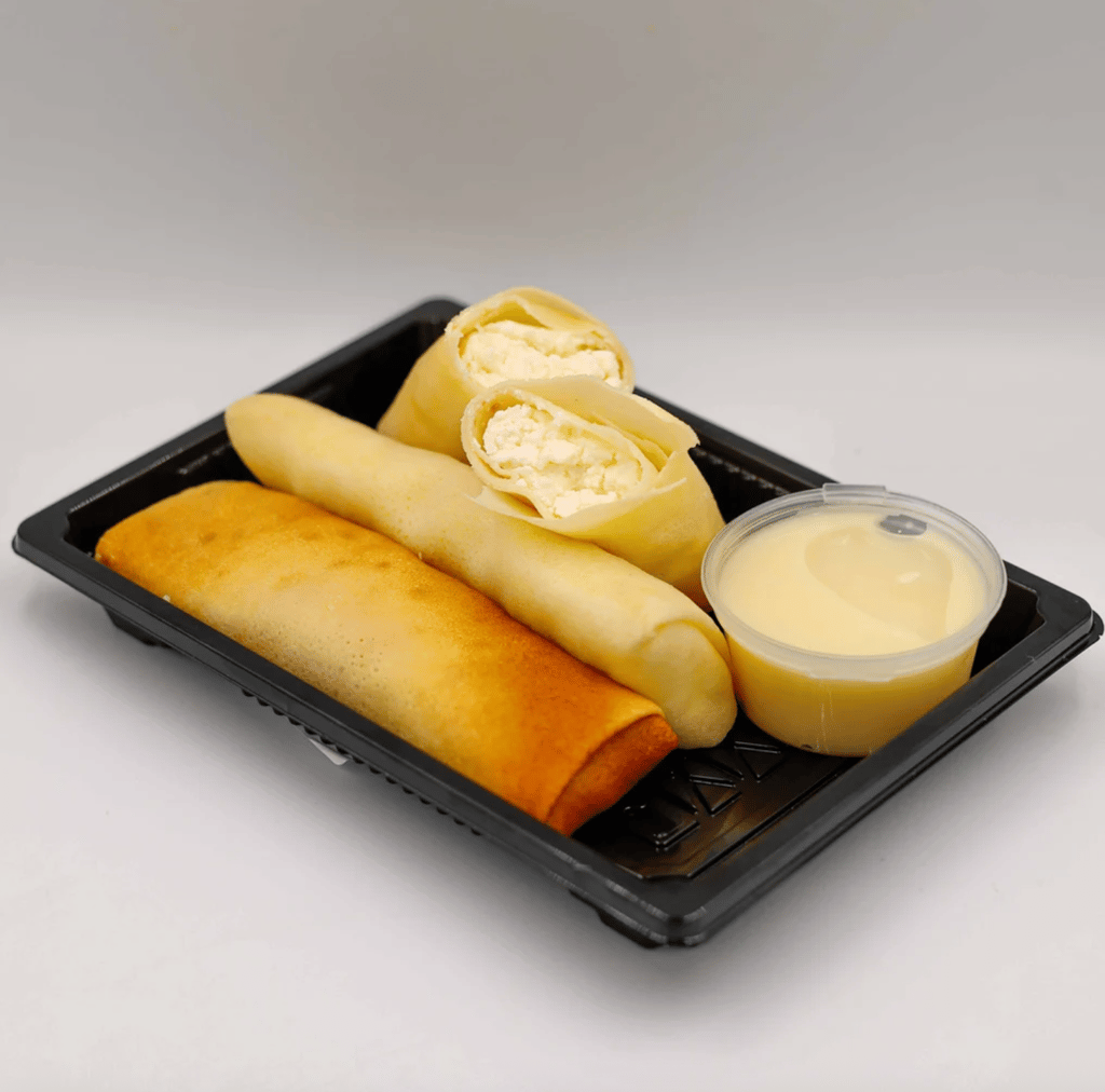 МЛИНЦІ З КИСЛОМОЛОЧНИМ СИРОМ ТА ВАНІЛЬНИМ СОУСОМ (ПОРЦІЯ)