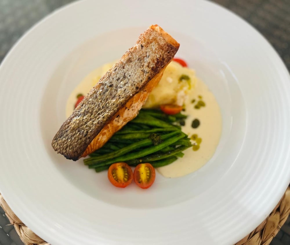 Salmon with lemon butter sauce and baked potato