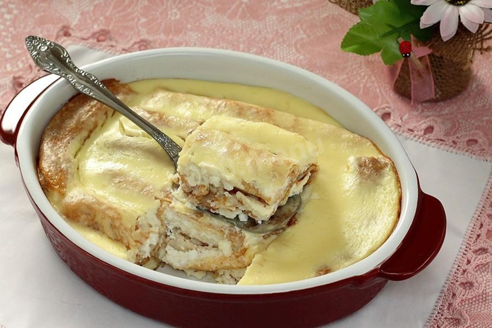 Млинці з сиром запечені у вершковому соусі 100г